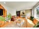 Bright and airy living room features hardwood floors, comfortable sofas and a vintage rug at 2237 Zinnia St, Golden, CO 80401