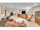Spacious living room with a neutral color palette, a large TV, and two separate lounge areas at 2237 Zinnia St, Golden, CO 80401