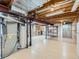 Spacious unfinished basement with exposed ceiling and ample storage space at 14057 E Arkansas Pl, Aurora, CO 80012