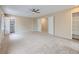 Expansive bedroom featuring neutral walls, plush carpeting, ceiling fan and walk-in closet at 14057 E Arkansas Pl, Aurora, CO 80012