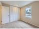 Cozy bedroom with a built-in closet and a bright window at 14057 E Arkansas Pl, Aurora, CO 80012