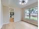 Bright dining room with hardwood floors and a large window overlooking the backyard at 14057 E Arkansas Pl, Aurora, CO 80012