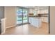 Open kitchen with granite countertops, white cabinets, and stainless steel appliances at 14057 E Arkansas Pl, Aurora, CO 80012