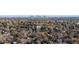 This aerial view captures the property's lush surroundings and its proximity to the city skyline at 2557 S Dover St # 68, Lakewood, CO 80227