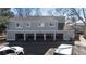 Exterior of townhome with multiple garages providing ample parking and storage options for residents at 2557 S Dover St # 68, Lakewood, CO 80227
