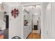 Galley kitchen with white cabinets and modern appliances with an opening leading to another room at 2557 S Dover St # 68, Lakewood, CO 80227