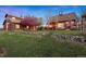 Expansive backyard featuring well-kept lawn and lovely, mature landscaping at 11689 Caribou Dr, Franktown, CO 80116