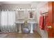 Dual sinks with pedestal basins and stylish fixtures, creating a functional and aesthetically pleasing space at 11689 Caribou Dr, Franktown, CO 80116