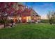Gorgeous backyard space with well-kept lawn and patio area at 11689 Caribou Dr, Franktown, CO 80116