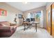 Comfortable office provides natural light, a leather chair, and ample desk space at 11689 Caribou Dr, Franktown, CO 80116