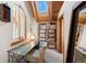 This bright office boasts a unique desk, natural light, and built in storage space at 11689 Caribou Dr, Franktown, CO 80116
