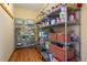 Walk-in pantry features ample shelving space for organized food storage in a well-lit area at 11689 Caribou Dr, Franktown, CO 80116