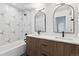 Modern bathroom featuring double sinks, stylish mirrors, and beautiful tile work at 3432 W 25Th Ave, Denver, CO 80211