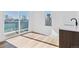 Bright bedroom with an adjoining patio and exterior views at 3432 W 25Th Ave, Denver, CO 80211