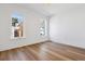 Bright bedroom with wood floors and two windows for natural light at 3432 W 25Th Ave, Denver, CO 80211