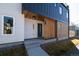 Modern exterior with a combination of textures and colors featuring a welcoming porch and sleek design elements at 3432 W 25Th Ave, Denver, CO 80211