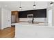 Modern kitchen featuring stainless steel appliances, sleek cabinetry, and a spacious center island at 3432 W 25Th Ave, Denver, CO 80211