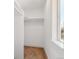 Clean, walk-in closet with a simple rod for hanging clothes and a window for natural light at 3432 W 25Th Ave, Denver, CO 80211