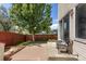 Inviting backyard space with a patio, mature trees, and a well-maintained lawn at 19917 Mitchell Cir, Denver, CO 80249
