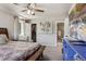 Comfortable bedroom featuring a ceiling fan, walk-in closet, and ensuite bathroom at 19917 Mitchell Cir, Denver, CO 80249