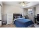 Comfortable bedroom with a ceiling fan, and natural light coming from the window at 19917 Mitchell Cir, Denver, CO 80249