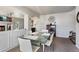 Open dining area with modern decor, seamless flow to the living room, and ample natural light at 19917 Mitchell Cir, Denver, CO 80249