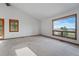 Spacious bedroom with carpeted floors, neutral walls, and lots of natural light at 2100 Bibles Hill Dr, Franktown, CO 80116