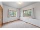 Simple bedroom with carpet, two windows, and a large closet at 2100 Bibles Hill Dr, Franktown, CO 80116