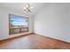 Dining room showcases stunning views, natural light, and a chandelier, great for entertaining at 2100 Bibles Hill Dr, Franktown, CO 80116