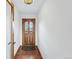 Entryway with tile flooring and wooden door with stained glass detail at 2100 Bibles Hill Dr, Franktown, CO 80116