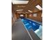 Indoor pool featuring natural lighting and cedar wood walls at 2100 Bibles Hill Dr, Franktown, CO 80116