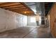 Unfinished basement with exposed beams, vapor barrier, and mechanical components at 5875 Raleigh Cir, Castle Rock, CO 80104