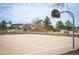 Community basketball court with surrounding greenery and neighborhood houses at 5875 Raleigh Cir, Castle Rock, CO 80104