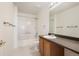 Bathroom featuring a tub with shower, vanity with countertop, toilet, and white tile at 5875 Raleigh Cir, Castle Rock, CO 80104