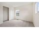 Bedroom featuring dual windows, neutral carpet, and a closet at 5875 Raleigh Cir, Castle Rock, CO 80104