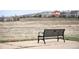 Outdoor bench with neighborhood view, perfect for relaxing and enjoying the natural scenery at 5875 Raleigh Cir, Castle Rock, CO 80104