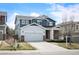 Charming two-story home with a two-car garage and manicured front yard at 5875 Raleigh Cir, Castle Rock, CO 80104