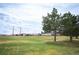 Expansive green space with mature trees and views of the neighborhood, perfect for recreation and relaxation at 5875 Raleigh Cir, Castle Rock, CO 80104
