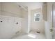 Clean laundry room featuring white walls, a window, and shelving at 5875 Raleigh Cir, Castle Rock, CO 80104