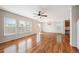 Bright living room with hardwood floors, large windows, and a stylish chandelier at 5875 Raleigh Cir, Castle Rock, CO 80104