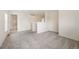 Spacious loft area featuring neutral carpet, light walls, and an open layout leading to the bathroom at 5875 Raleigh Cir, Castle Rock, CO 80104