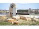 Mitchell Gulch Park sign with landscaping rocks and grassy area at 5875 Raleigh Cir, Castle Rock, CO 80104