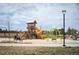Community playground featuring modern play equipment and open spaces for children to enjoy outdoor activities at 5875 Raleigh Cir, Castle Rock, CO 80104