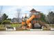 Community playground with slides, swings, and climbing structures for  at 5875 Raleigh Cir, Castle Rock, CO 80104