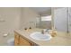Bright bathroom showcasing a large mirror and vanity with a white sink at 843 Snowberry St, Longmont, CO 80503
