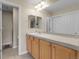 Bathroom featuring ample cabinet space, large mirror and updated lighting fixtures at 843 Snowberry St, Longmont, CO 80503