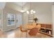 Bright dining area featuring hardwood floors, contemporary furnishings, and abundant natural light, creating a welcoming atmosphere at 843 Snowberry St, Longmont, CO 80503
