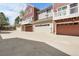 Exterior view of townhome showcasing attached garages and private entrances at 843 Snowberry St, Longmont, CO 80503