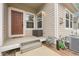 Inviting covered front porch with neutral siding, contrasting trim, and convenient utility access at 843 Snowberry St, Longmont, CO 80503