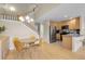 Open-concept kitchen with stainless steel appliances, light wood cabinets, and a dining area, perfect for Gathering gatherings at 843 Snowberry St, Longmont, CO 80503